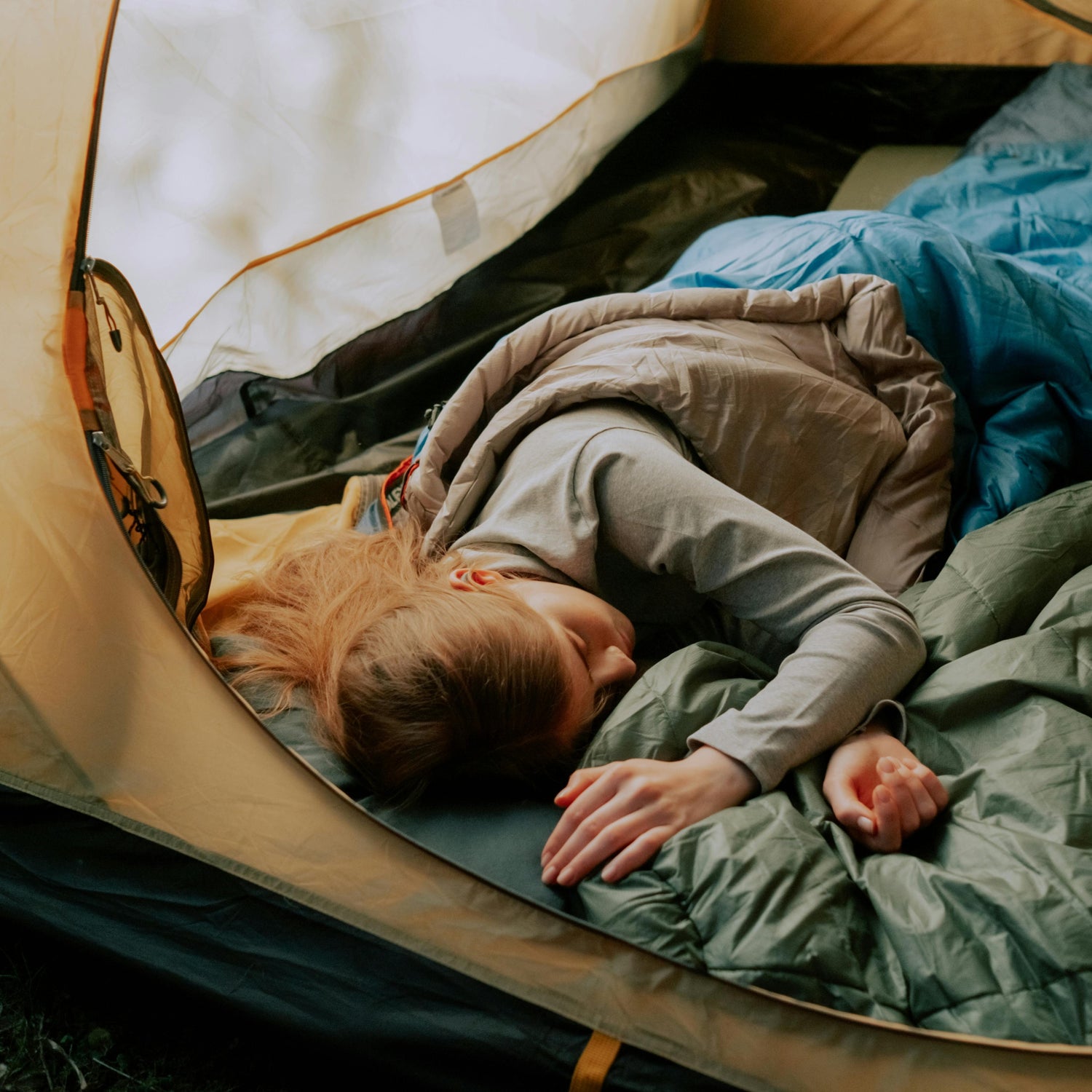 Person sleeping in a tent