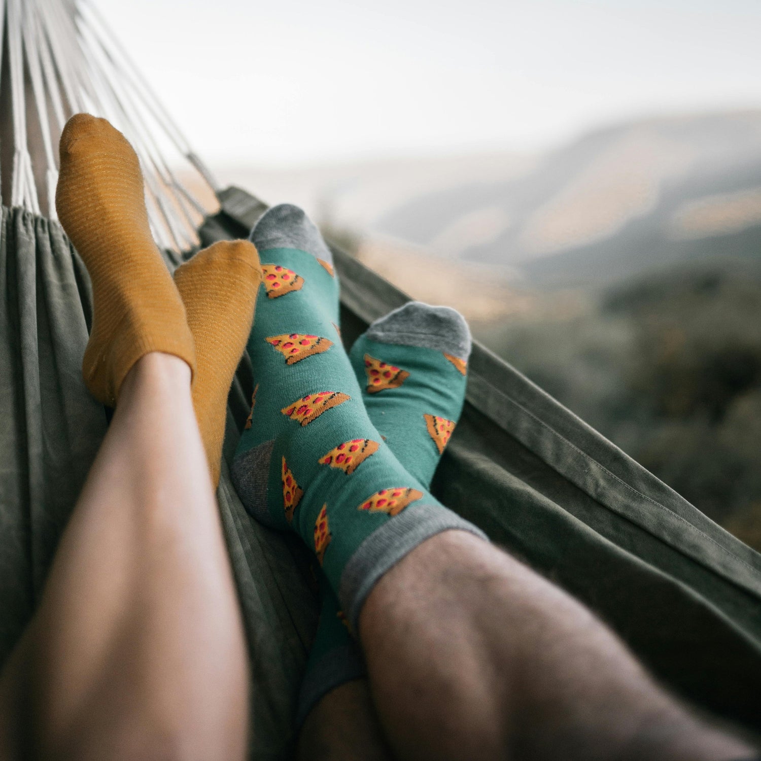 Feet in socks in a hammock